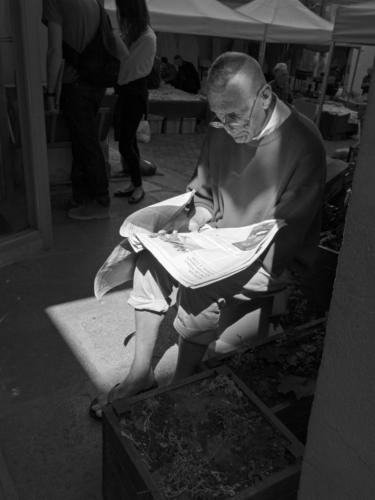 IMG_1778_reading_paper_b+w